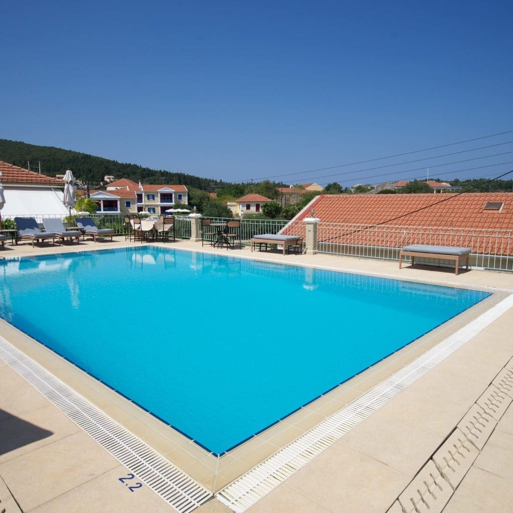 Swimming pool terrace overlooking the sea at Porto Fiscardo