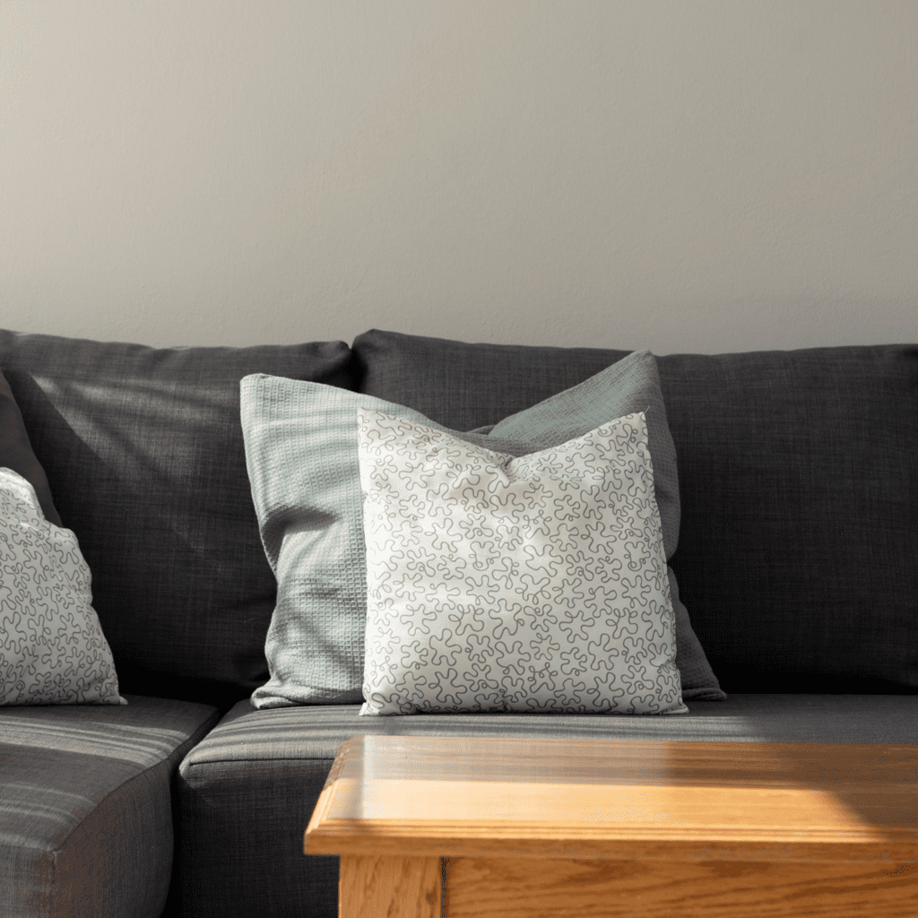 Apartment lounge sofa with cushions at Porto Fiscardo