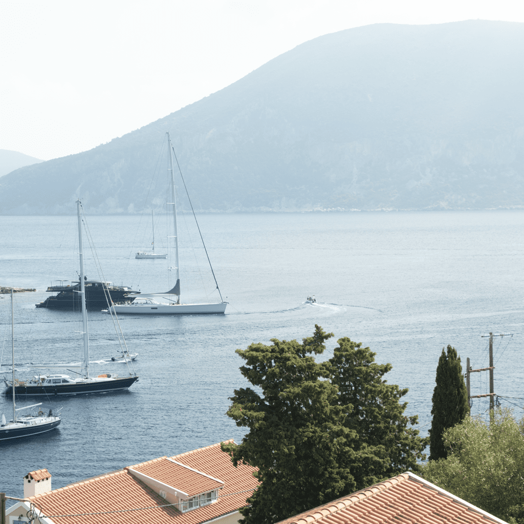 Sailboats anchored in calm bay near Fiskardo Kefalonia