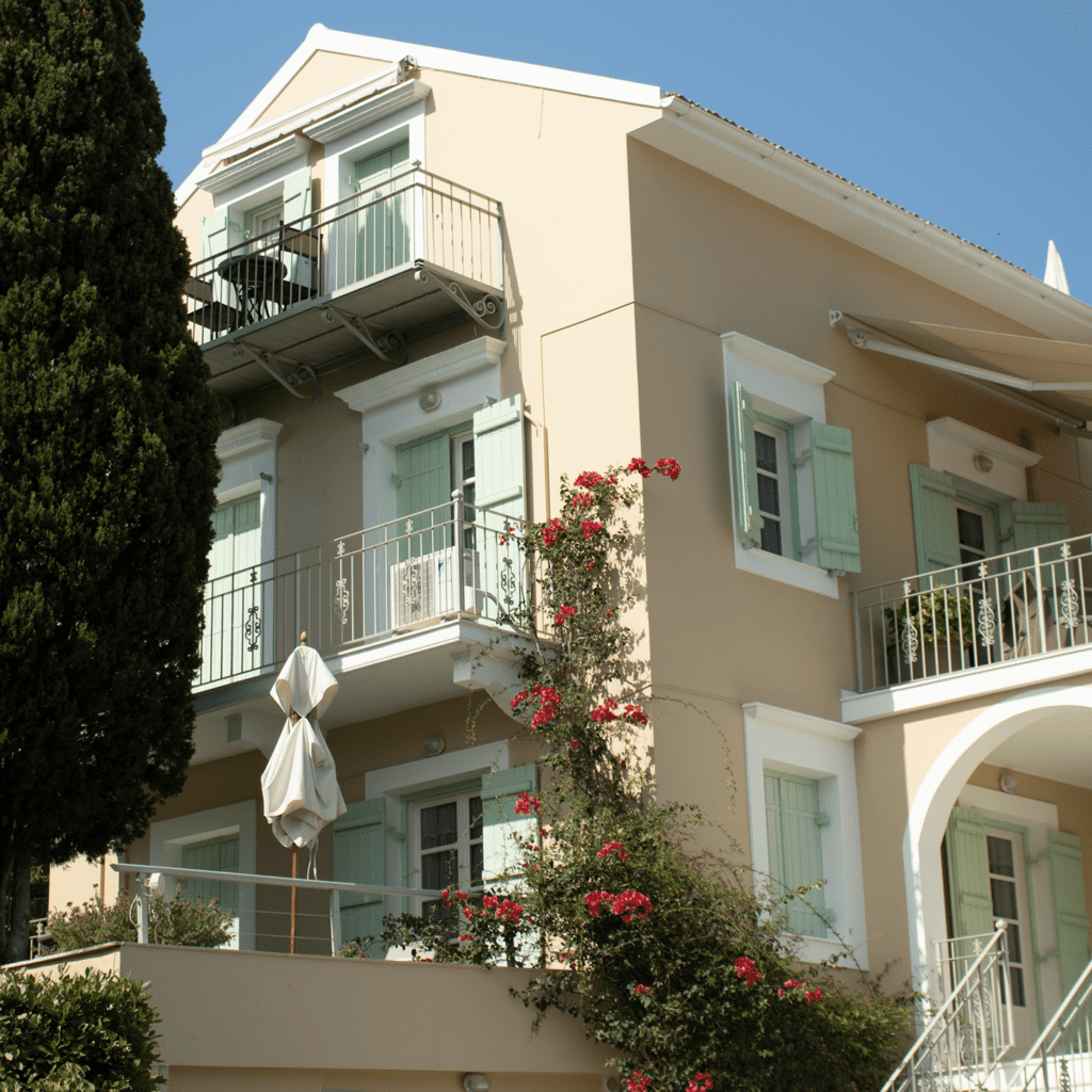 Traditional Kefalonia architecture with balconies and flowers in Fiskardo