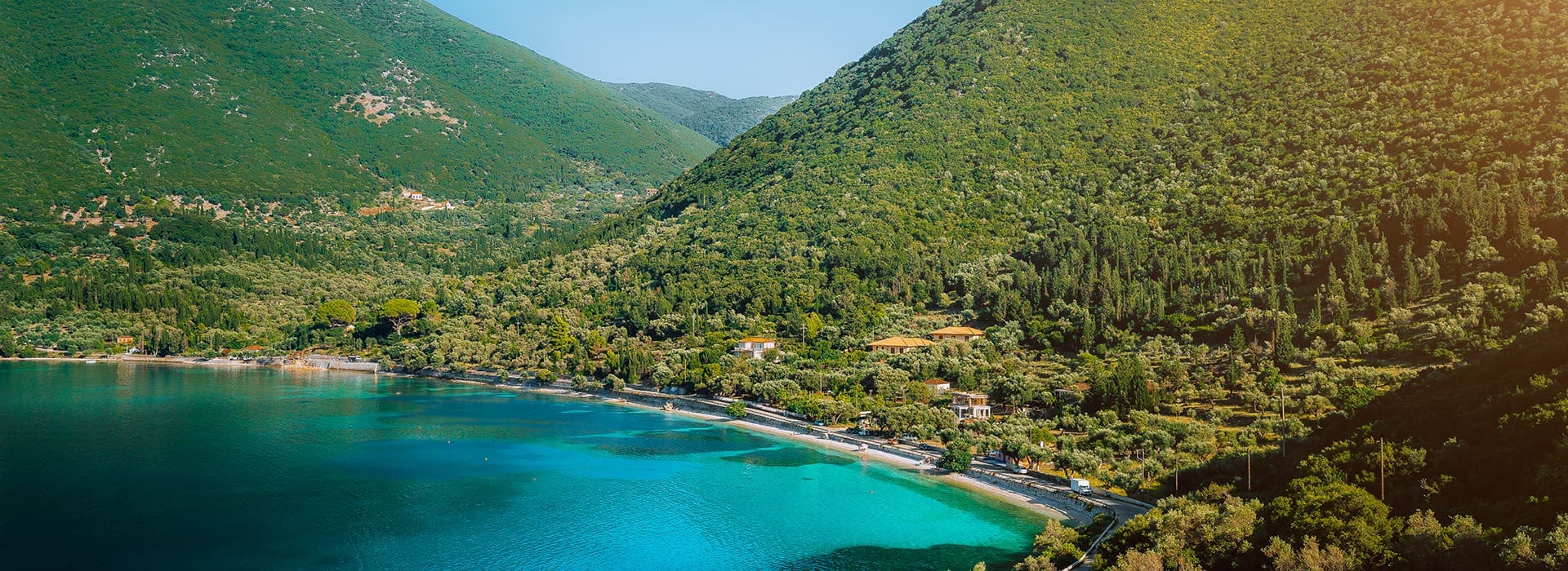 Antisamos Beach bay framed by green hills on Kefalonia Greece