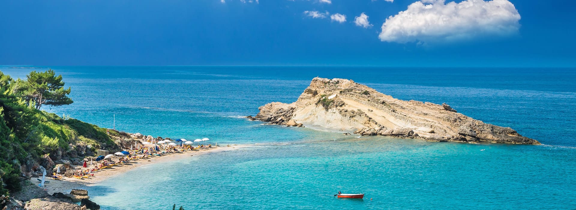 Turquoise waters near Argostoli Kefalonia with a lone fishing boat